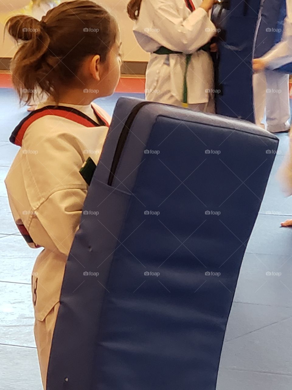 martial arts taekwondo lessons holding target