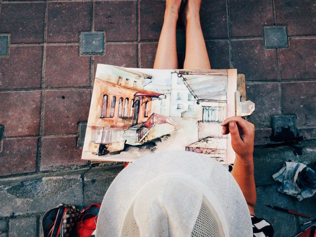 Woman painting on the street 
