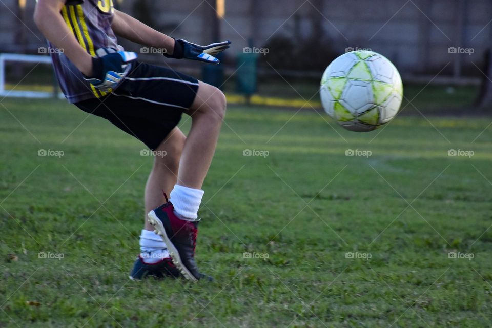 boy playing soccer