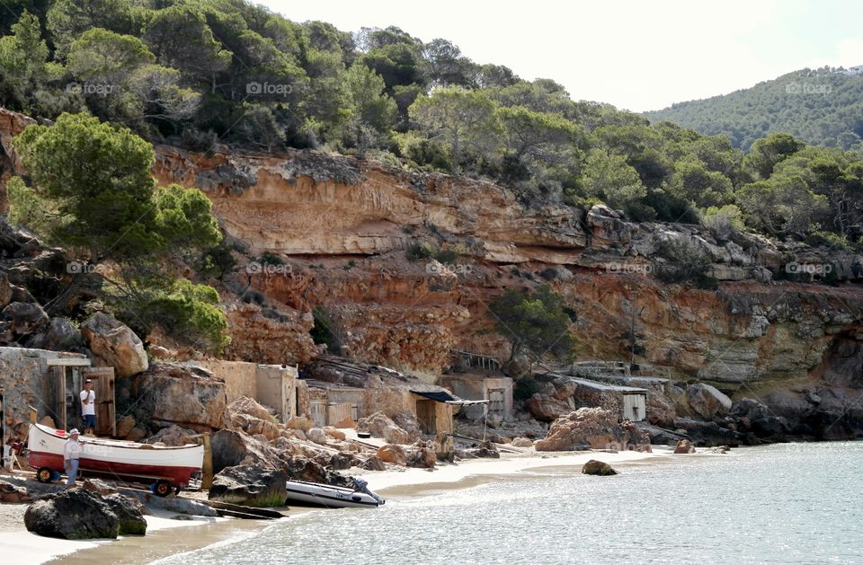 Fishermen boathouses by Cala Saladeta in Ibiza 