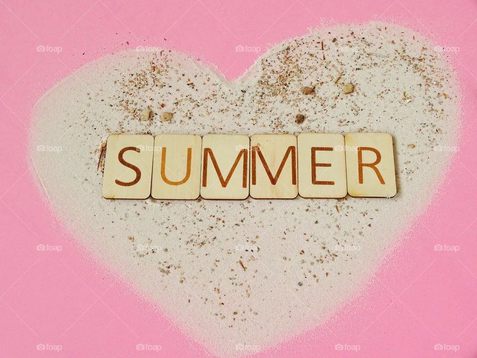 Wooden letters Summer in sand