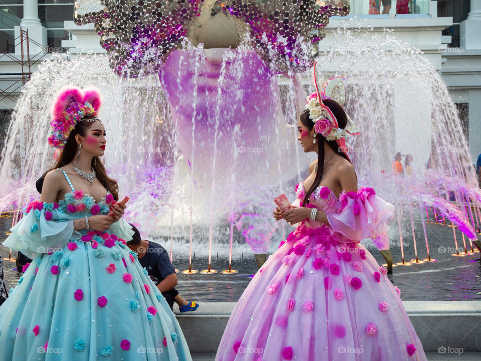 Transgender awaiting tourist to take photo with them in exchange of monetary tip.