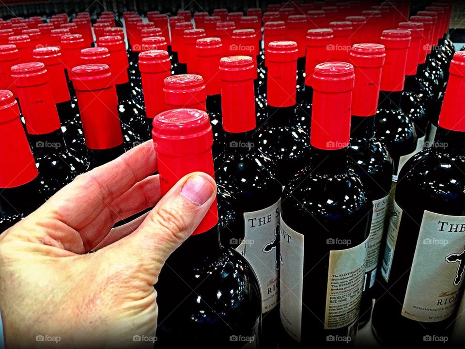 Hand reaching for wine