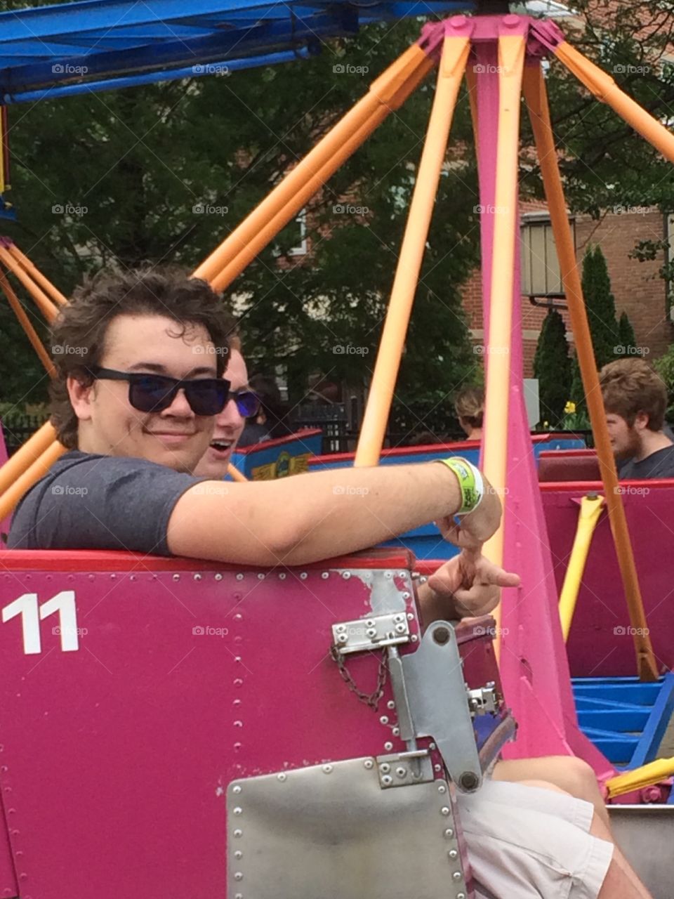 Teenager on roller coaster ride 