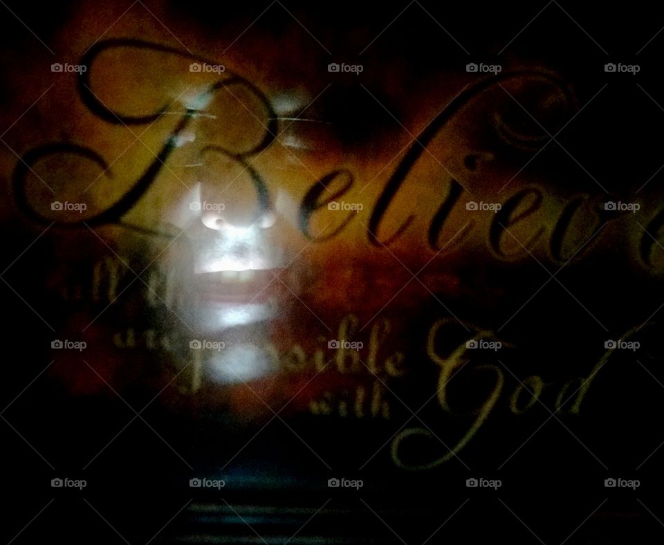 face reflection on glass