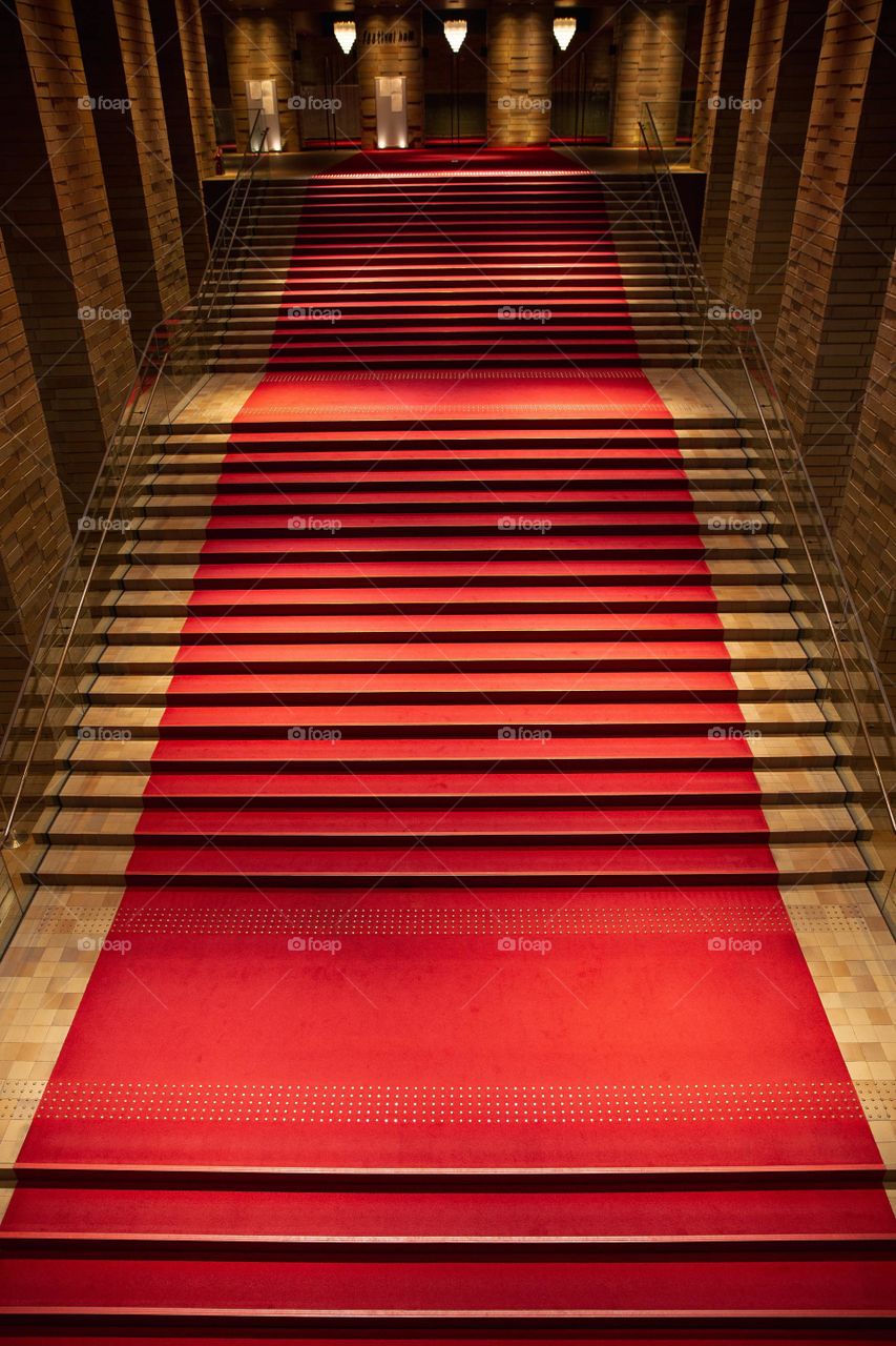 Red carpet stairs in building