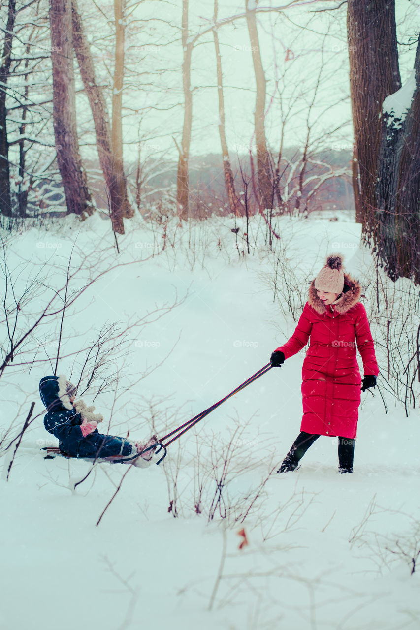 Winter with friends. Spending wintertime outdoors playing with snow