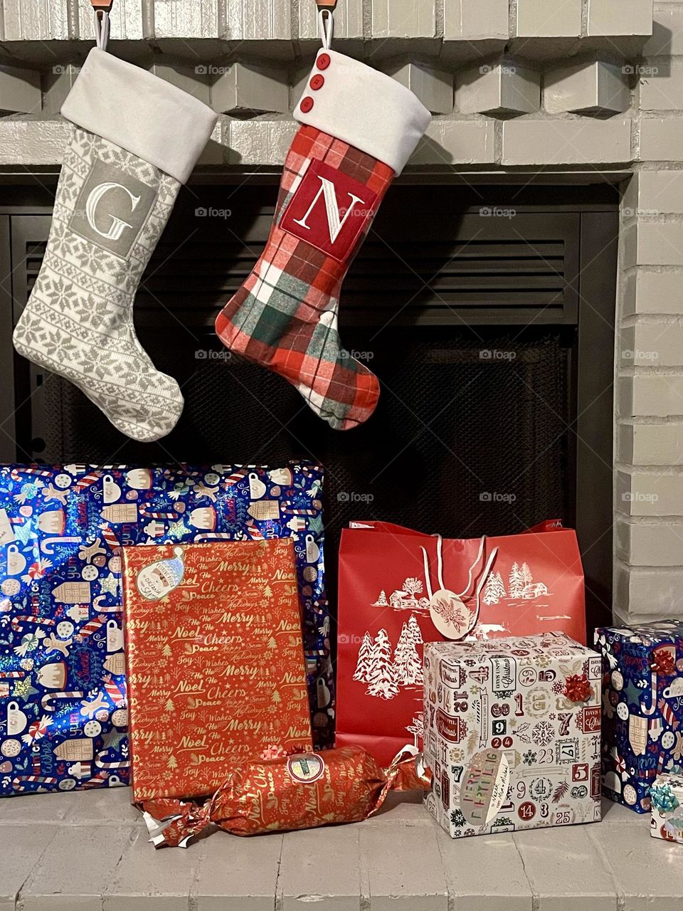 Fireplace with gifts boxes. Christmas presents 