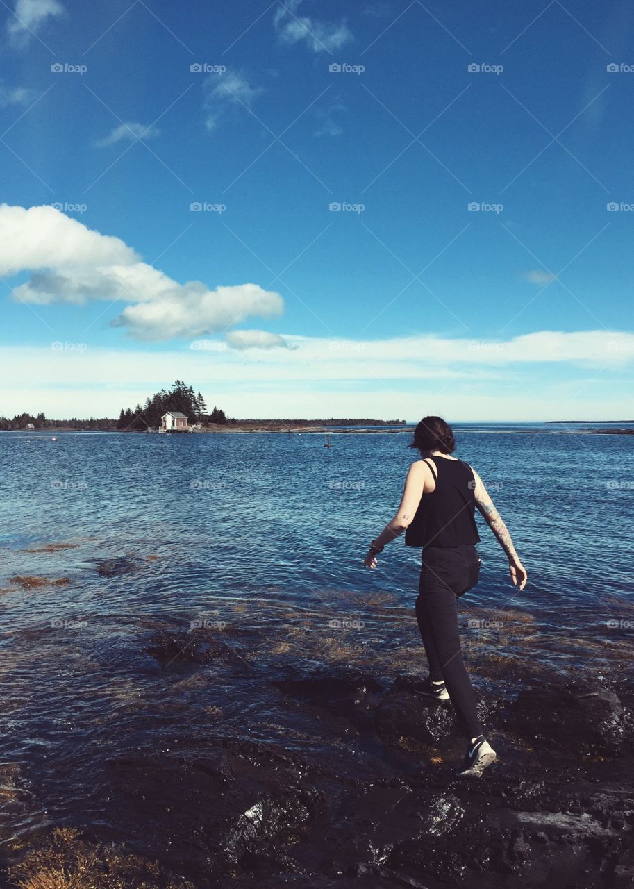 Walking on water in historic east coast fishing village of Blue Rocks, Nova Scotia, Canada.