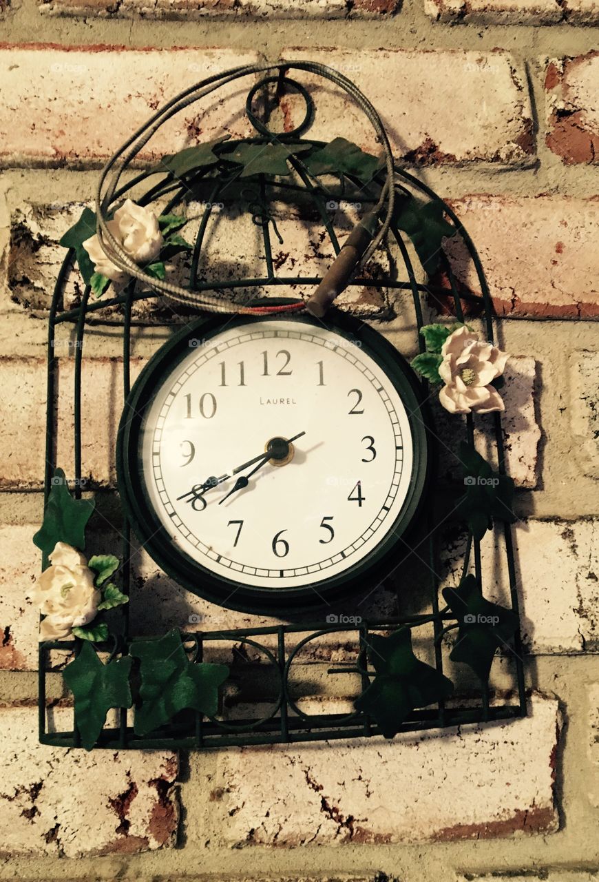 Clock on brick wall 
