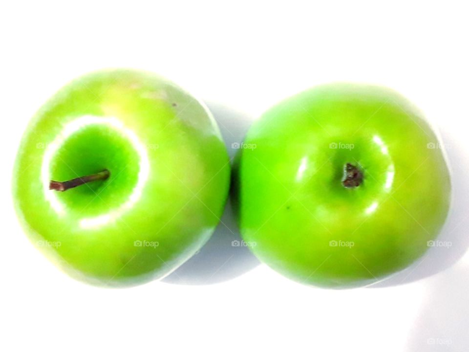 two green apples on a white background