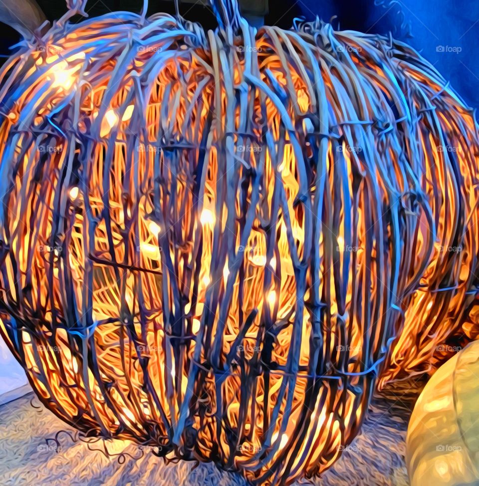 lit up wicker pumpkin