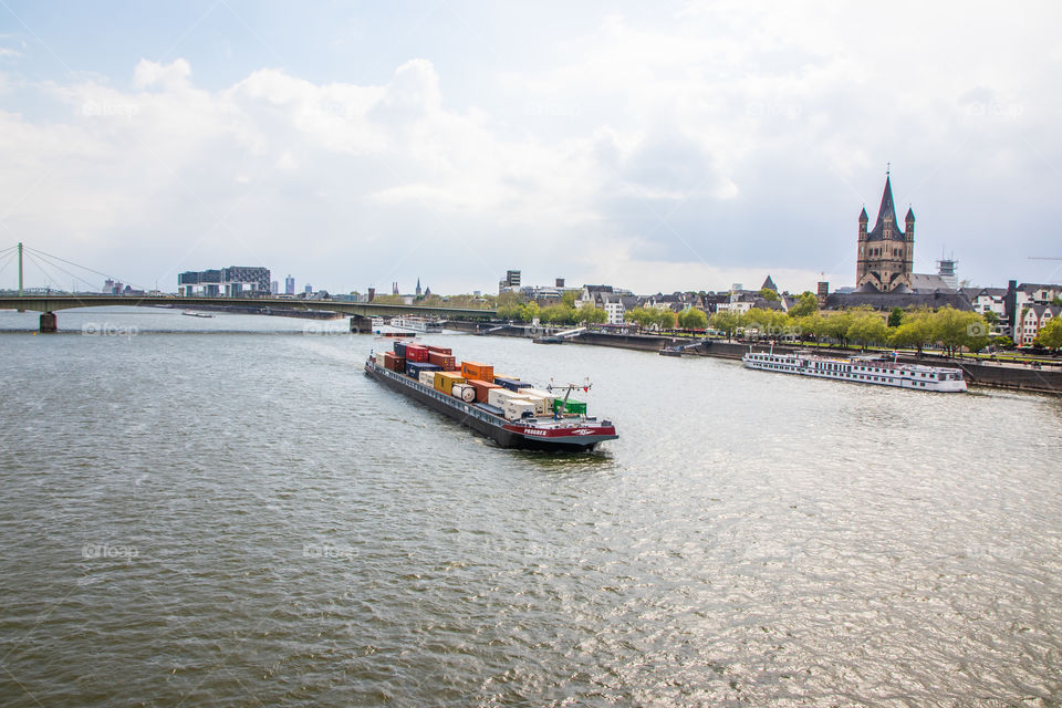 a International Container Ship on the way at the rhine river in Cologne NRW Germany Europe