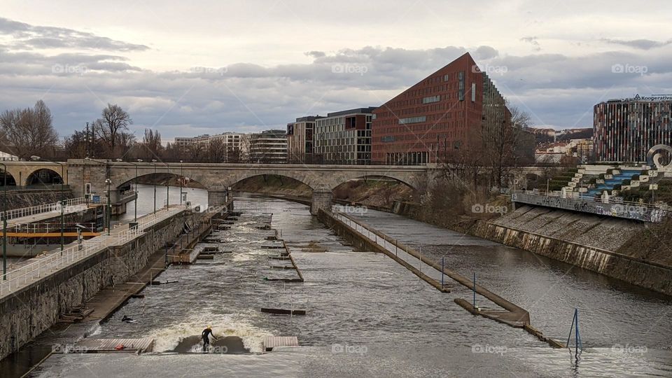 Surfers training on the Vltava River in Prague.