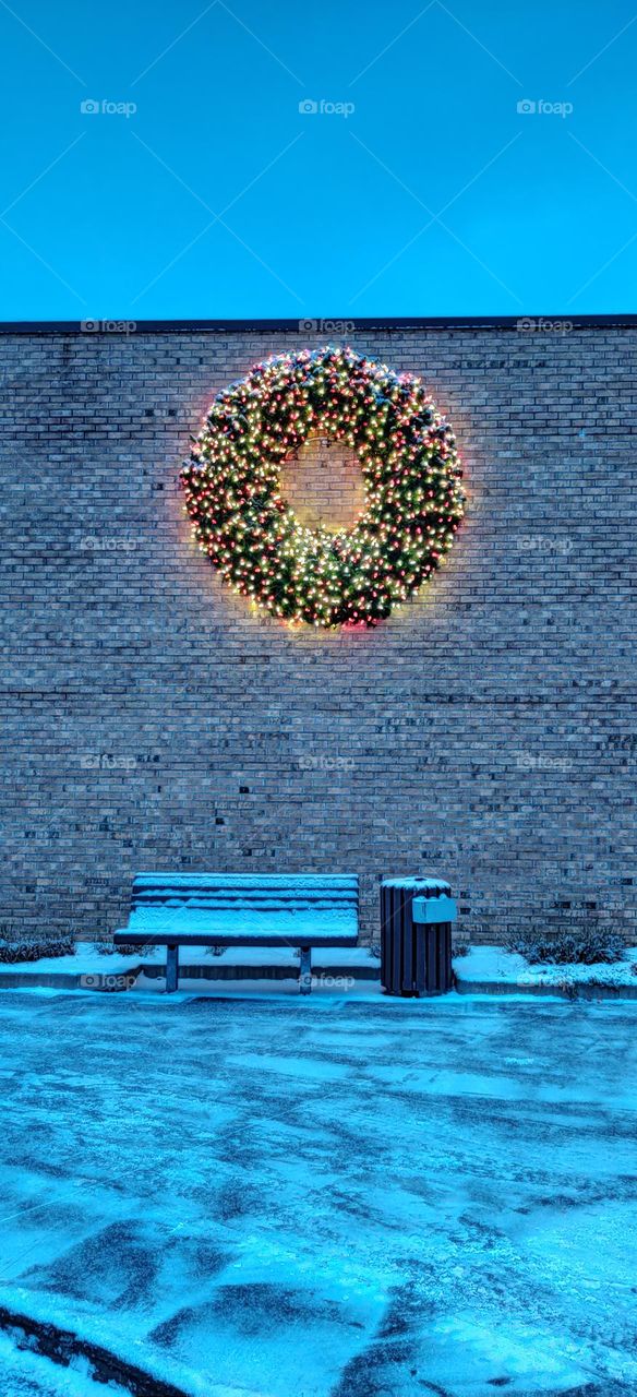 Christmas decorations and a bench with a snow