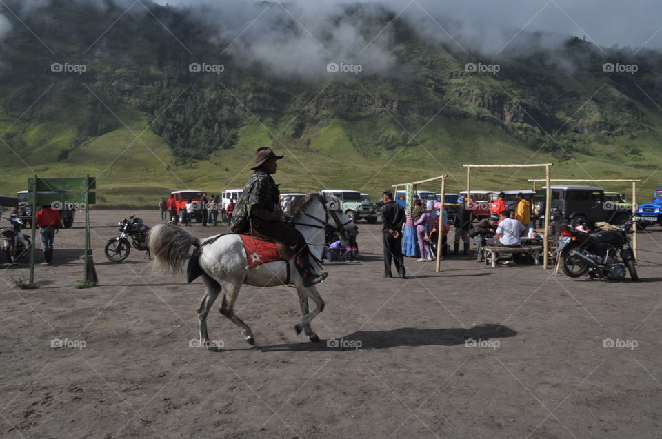 old man riding horse