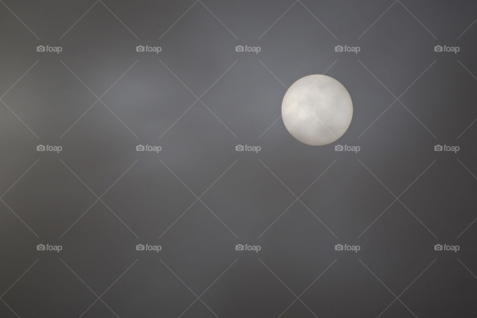 Moon in sky during foggy night