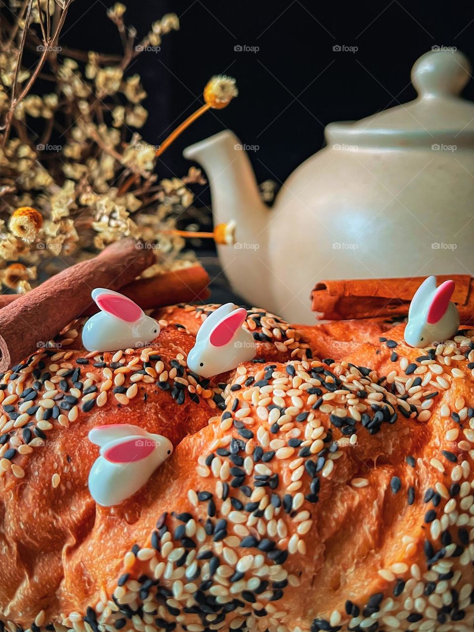 Cute miniature rabbits on sesame bread in close up view