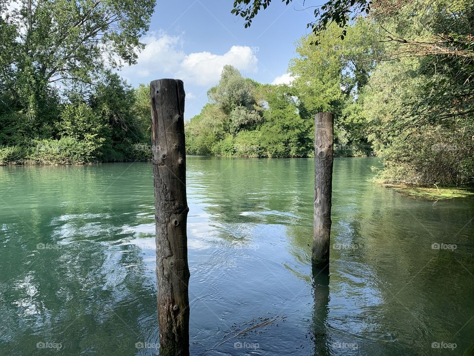 The placid flow of the spring river Sile in the stretch between Casier and Casale sul Sile in the Venetian countryside.