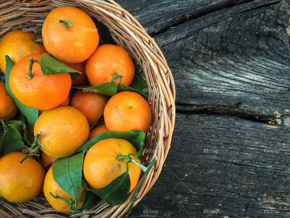 Fresh tangerines in basket