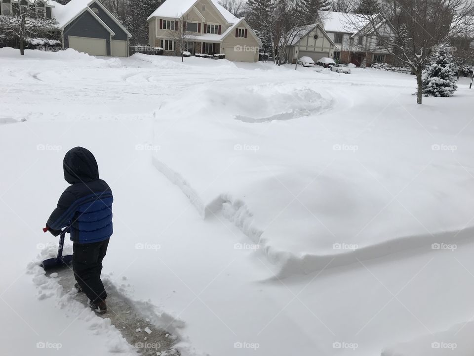 Toddler shoveling 