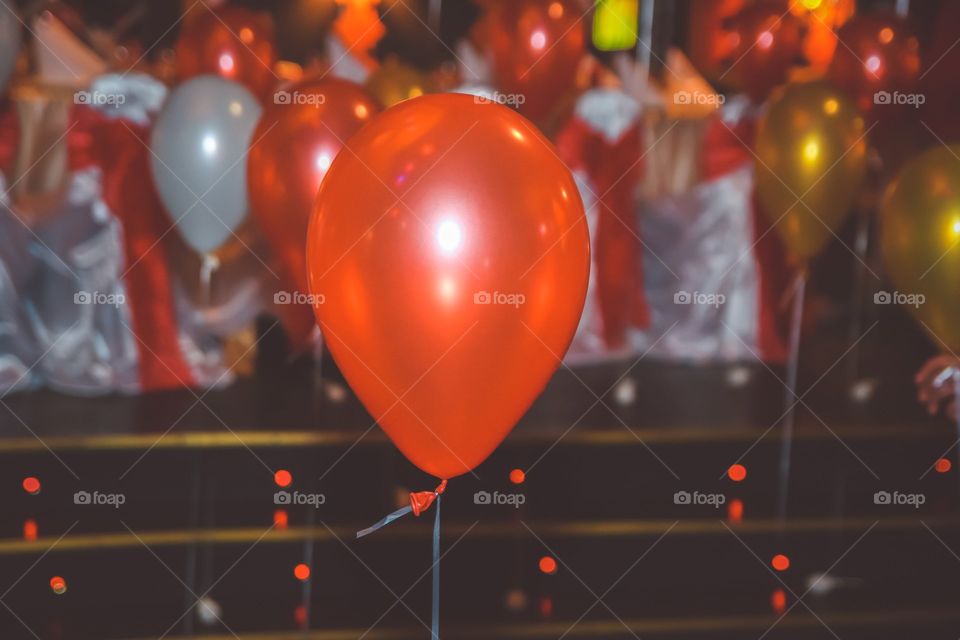 Ballons decoration on celebration. One red ballon among ballons decoration