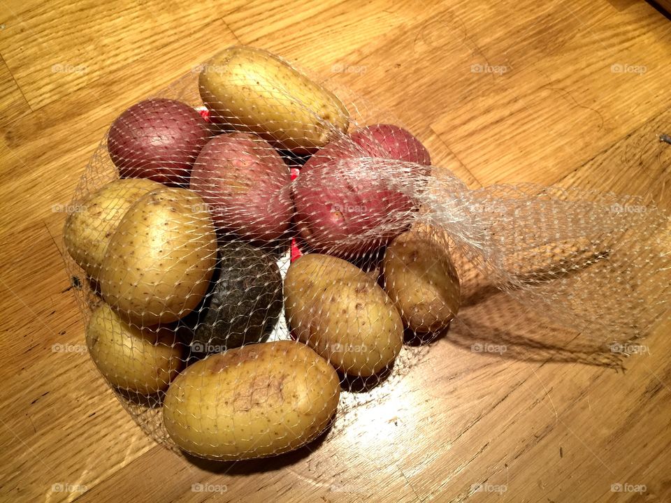 Bag of colorful potatoes 