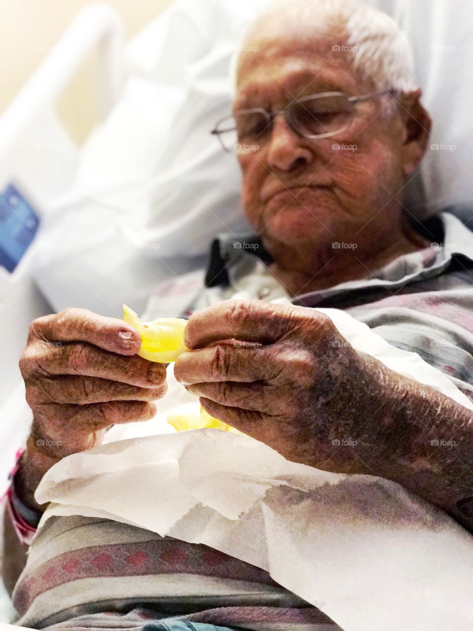 Senior man in hospital bed