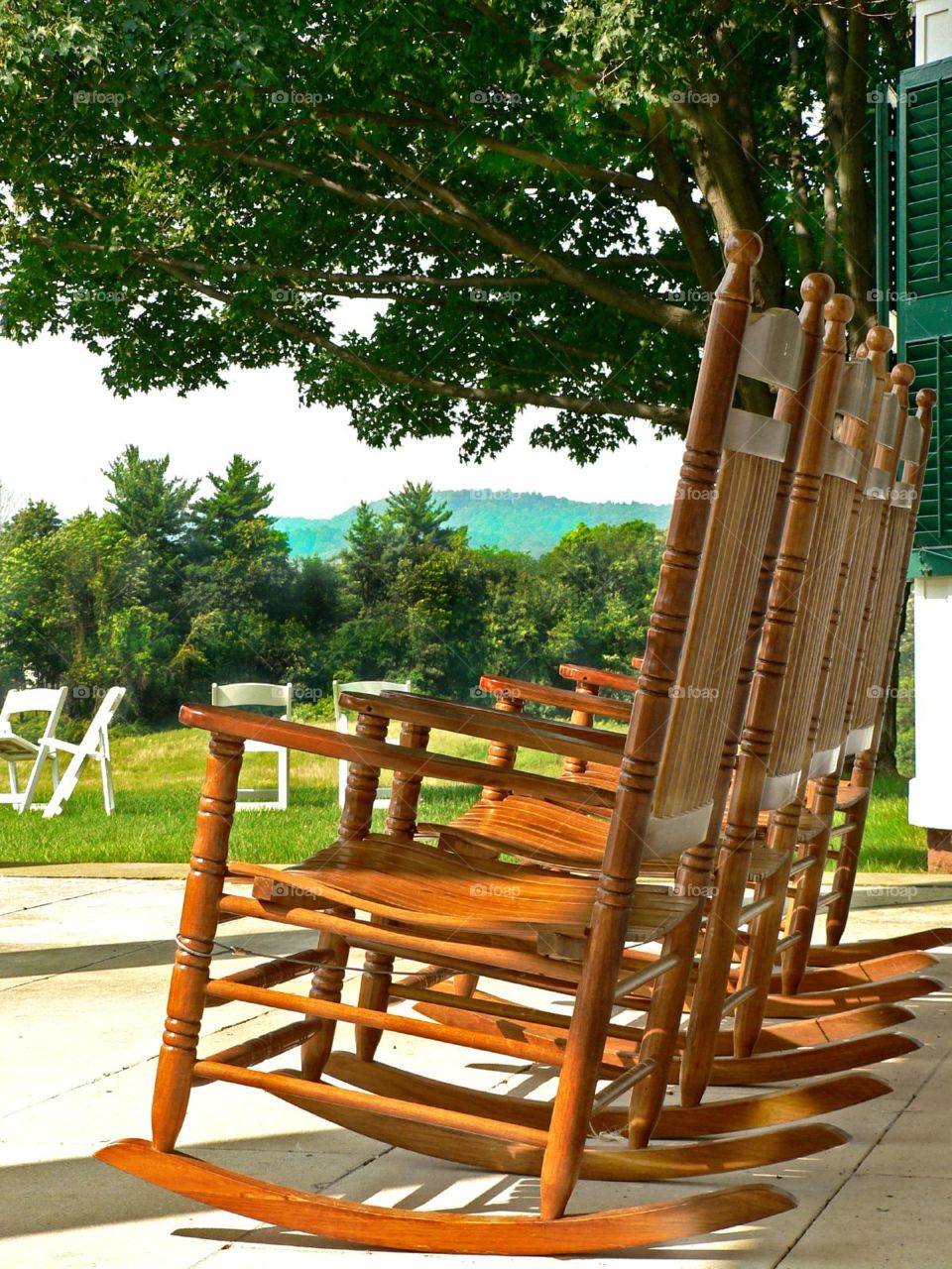 Set a spell. Empty rockers waiting for someone to relax and on the porch