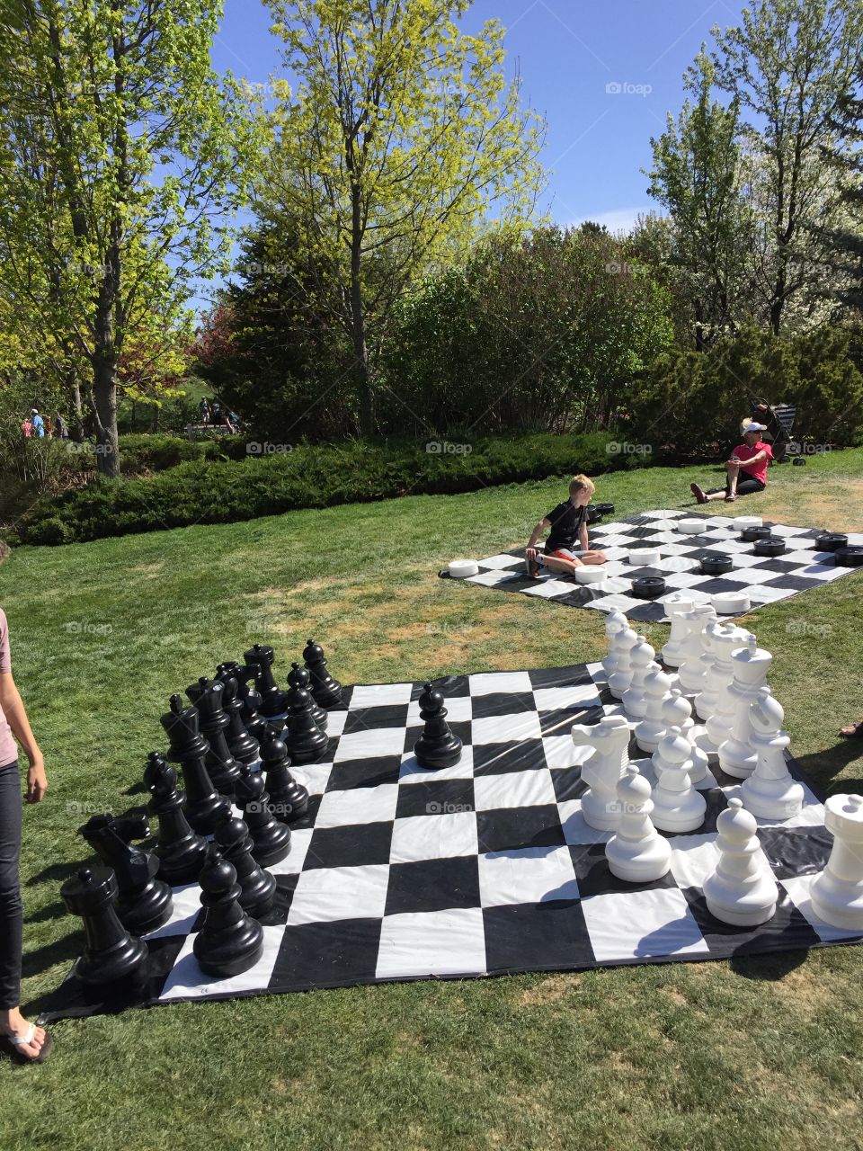 Giant chess and giant checkers. Park. Entertainment for kids and adults. 