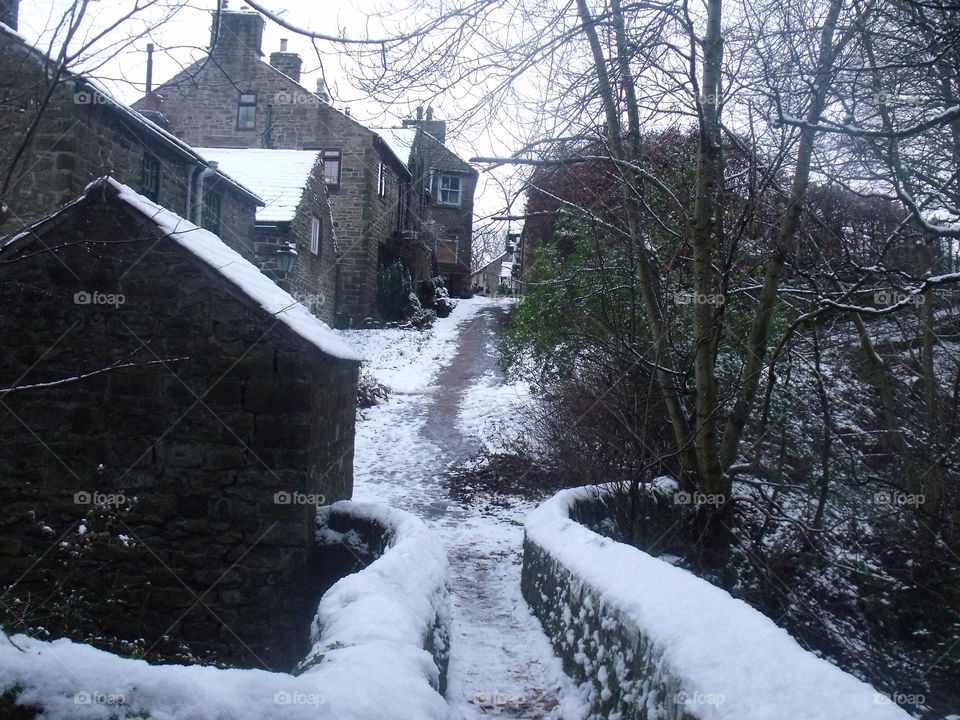 footpath through a snowy village