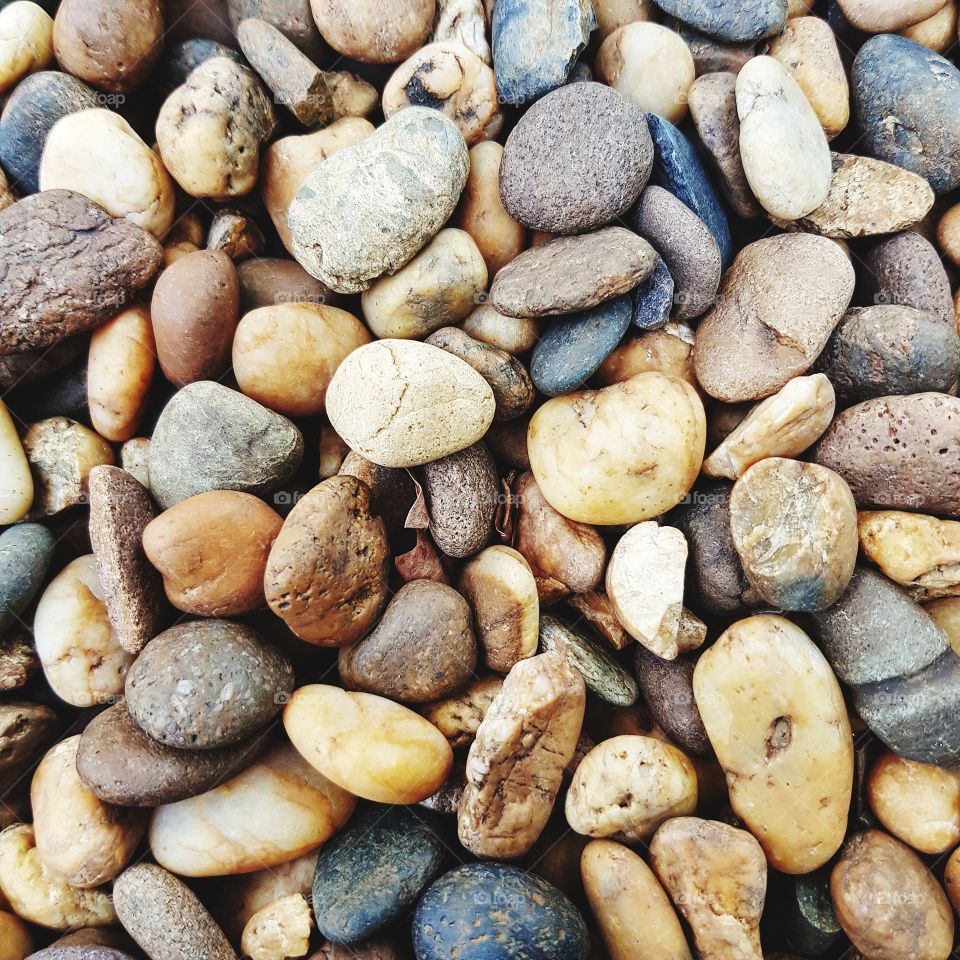 Multi colored stones at pebble beach