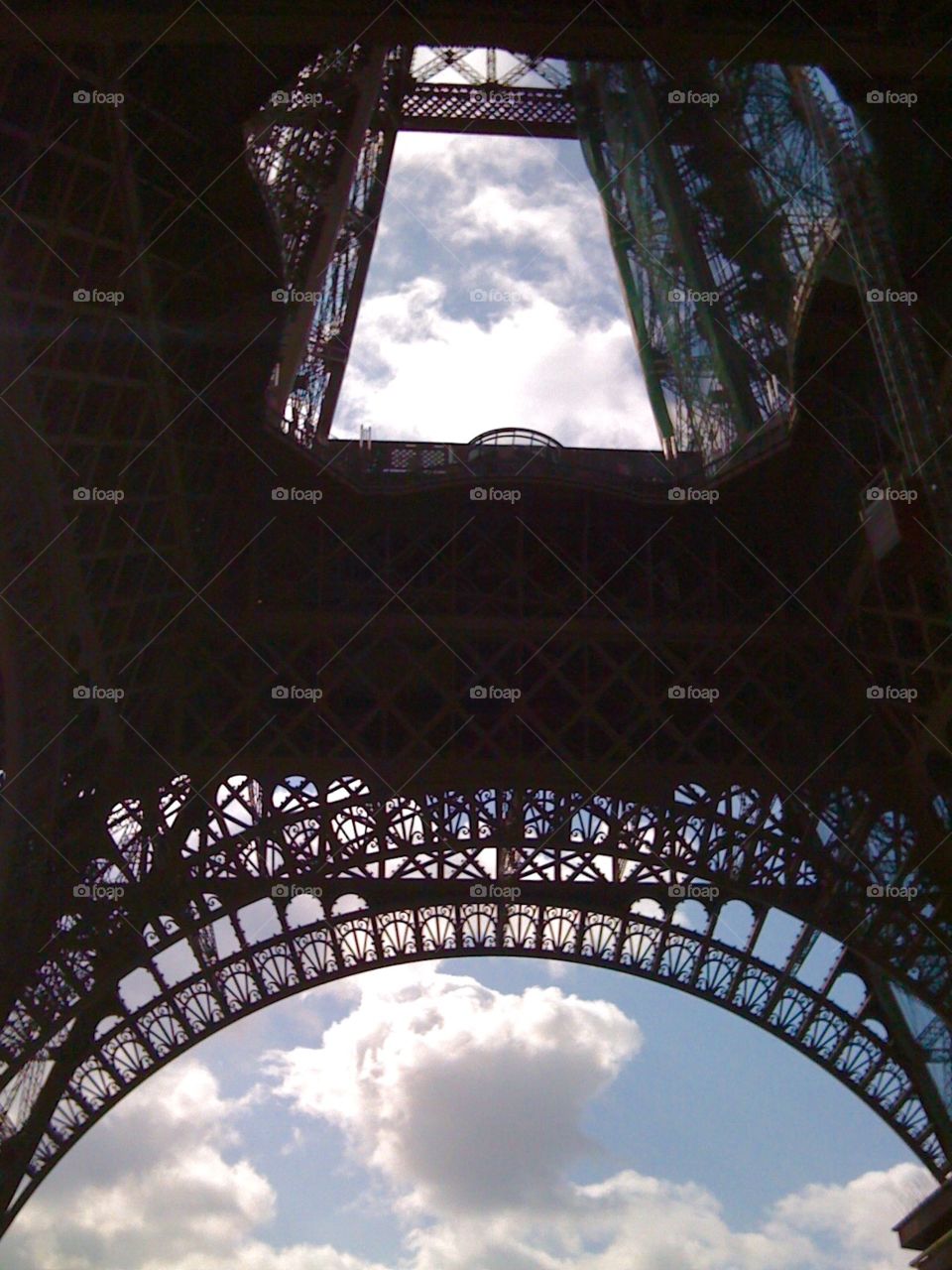 Inside the Eiffel . The arches of the Eiffel Tower taken from below