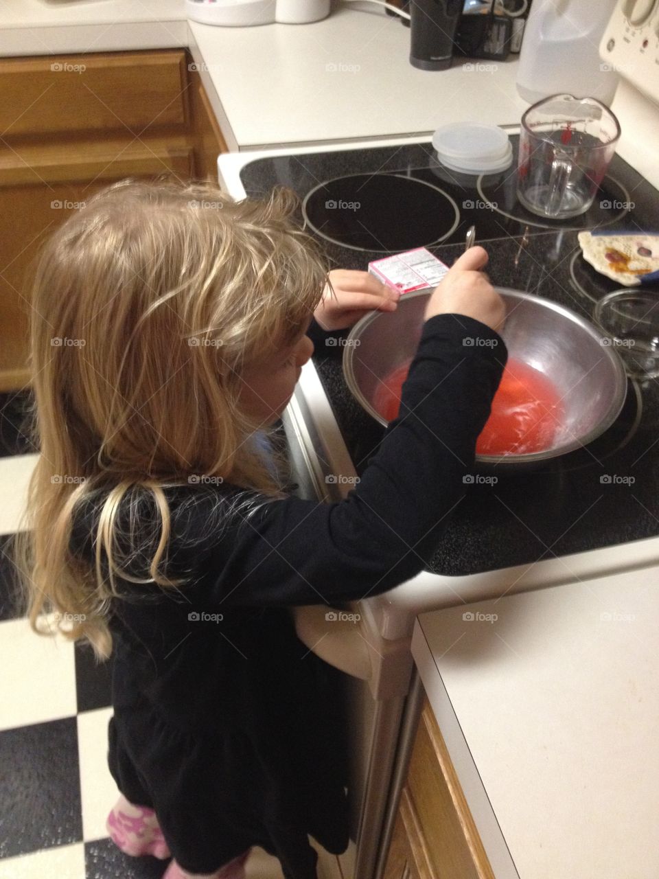 Kitchen helper making Jell-O