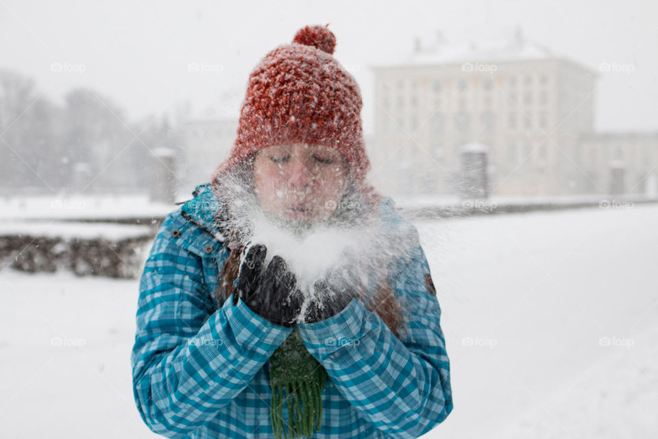 Woman playing in the snow 