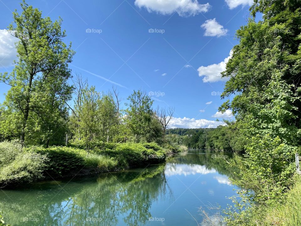 water landscape grass and clouds