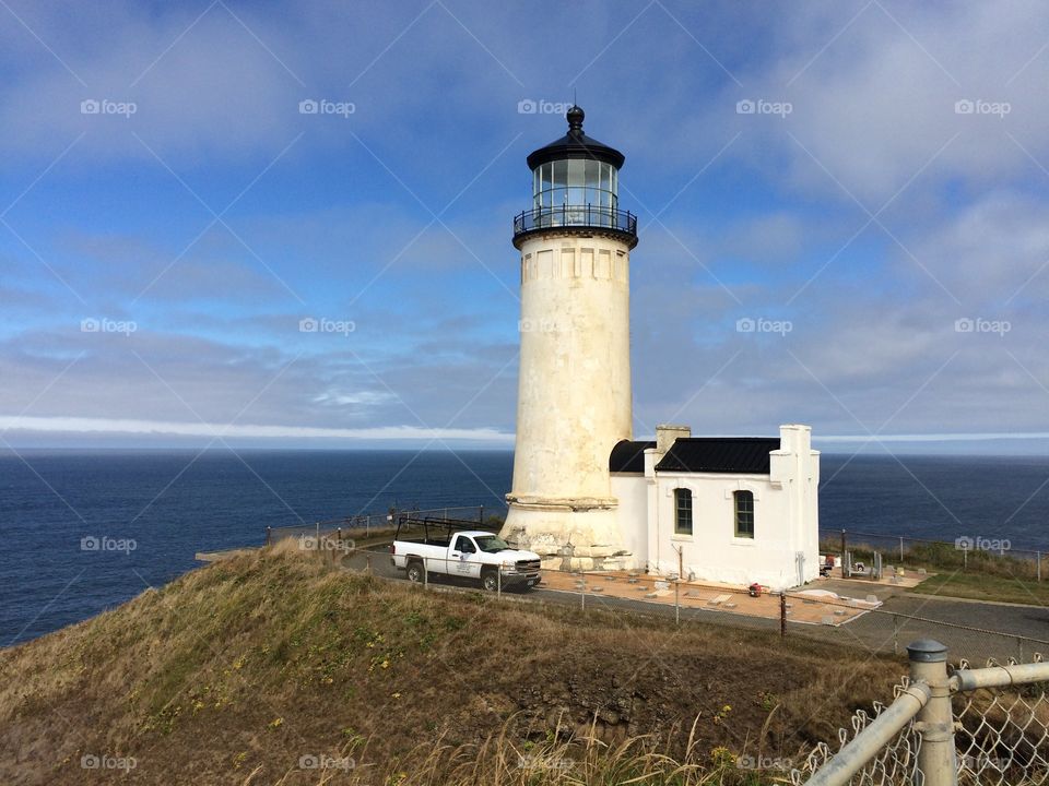 Lighthouse against blue sea