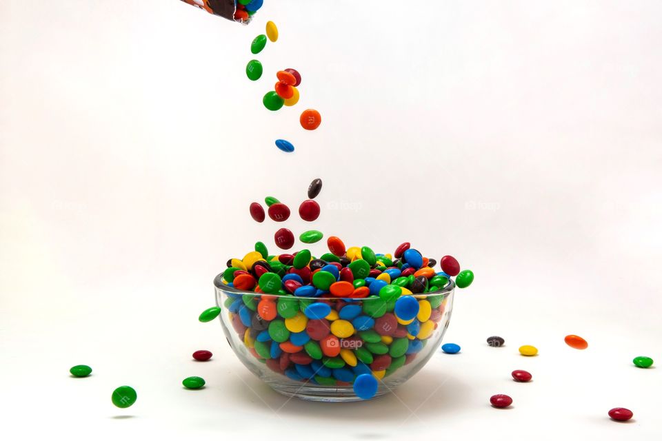 Pouring a Bowl of M & M candy