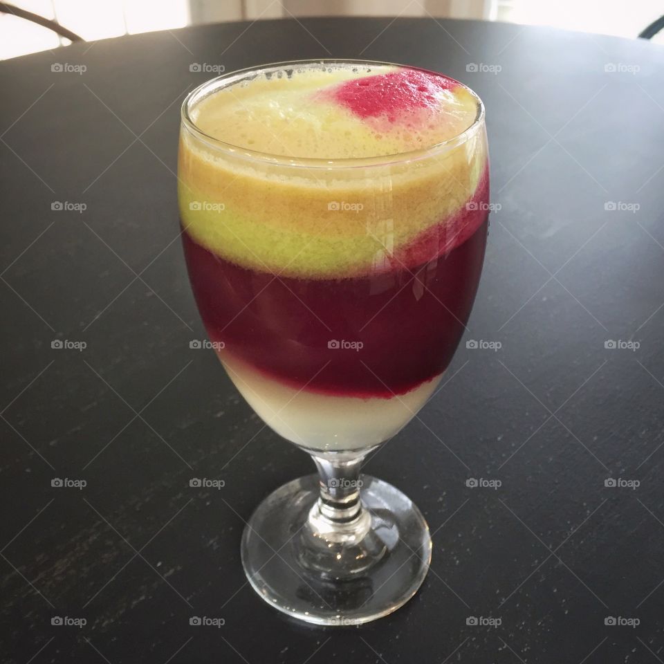 Cocktail juice in glass on table