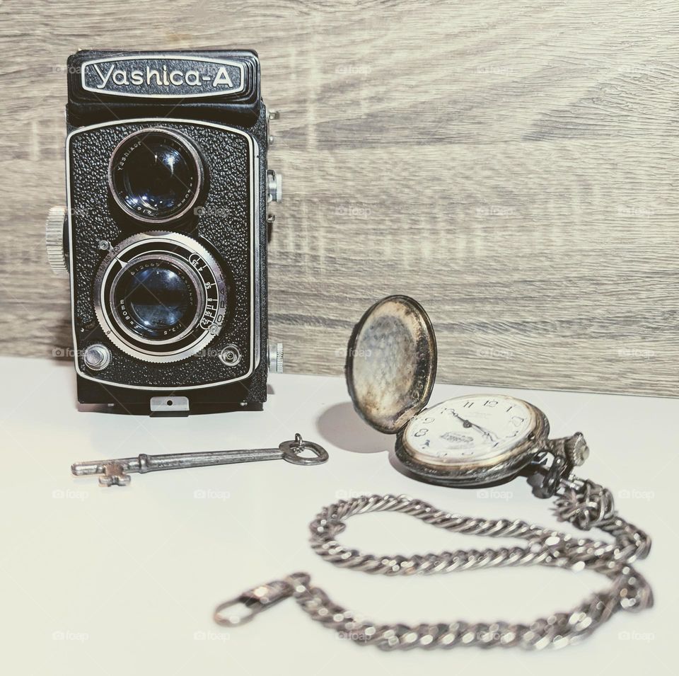 vintage camera, pocket watch and skeleton key