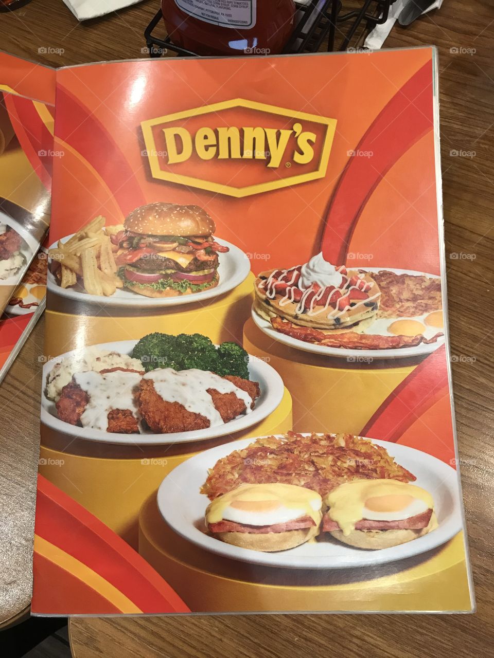 Denny’s visual menu. It contains a large selection of meals to order from, and accompanying photos showing what they look like.