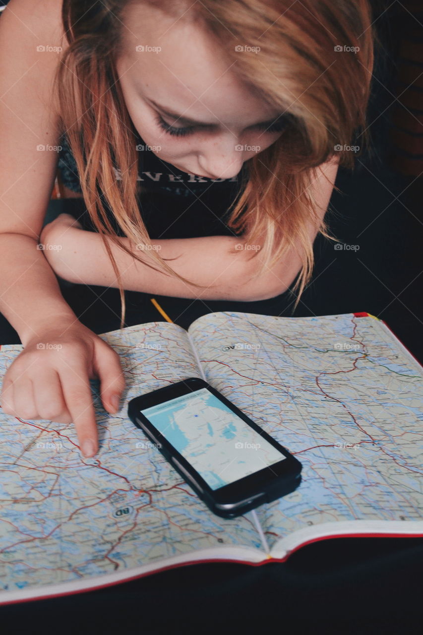 Girl looking at maps