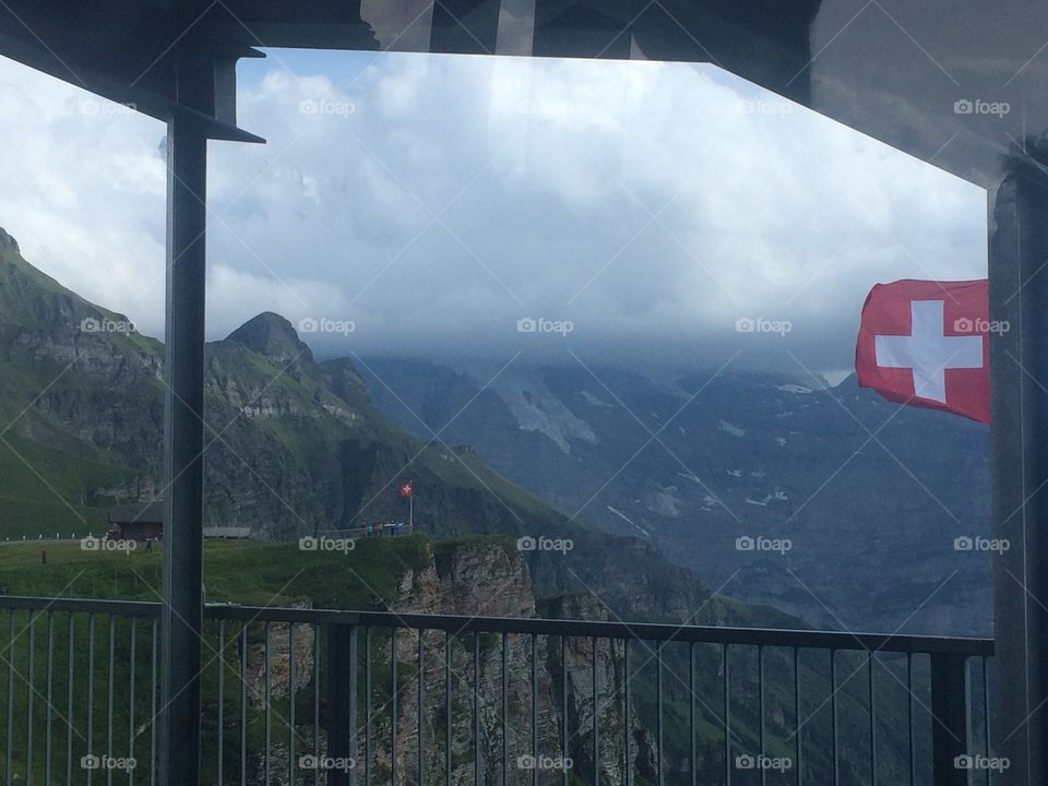Swiss mountain panorama with Switzerland flag