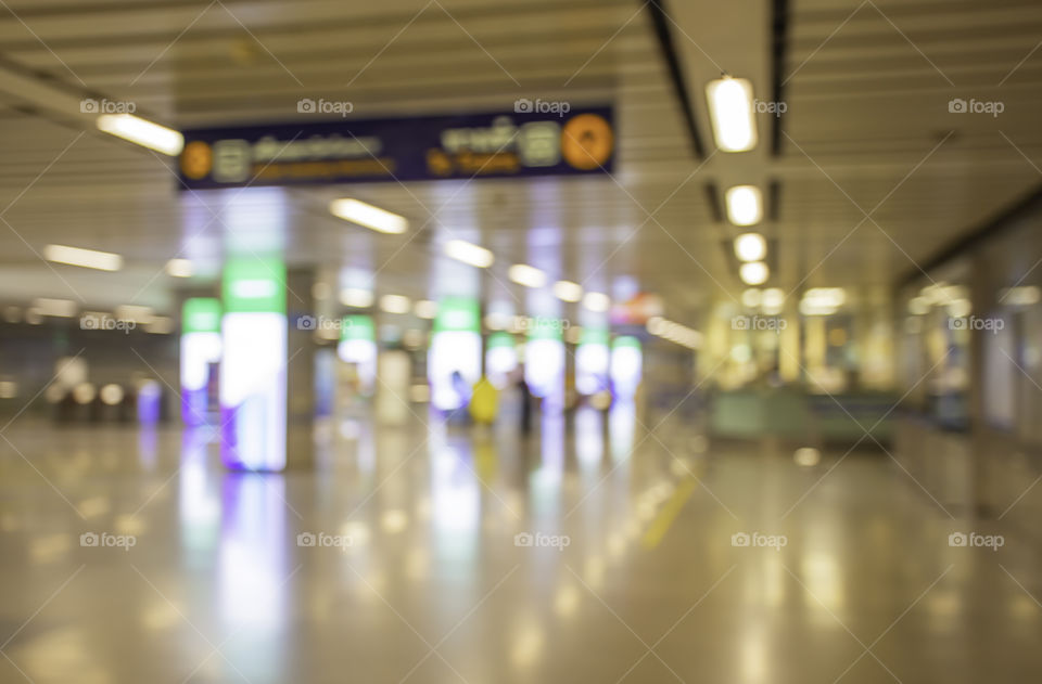 Blurry image of a passenger stand waiting for the subway