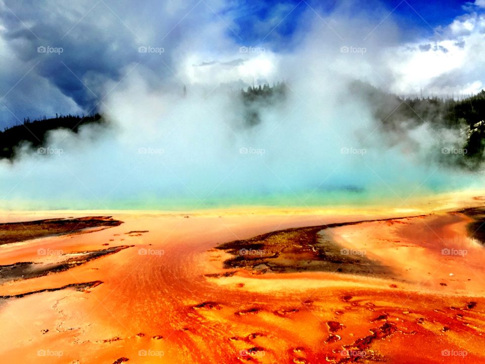 Brilliantly colored steaming thermal spring in Yellowstone