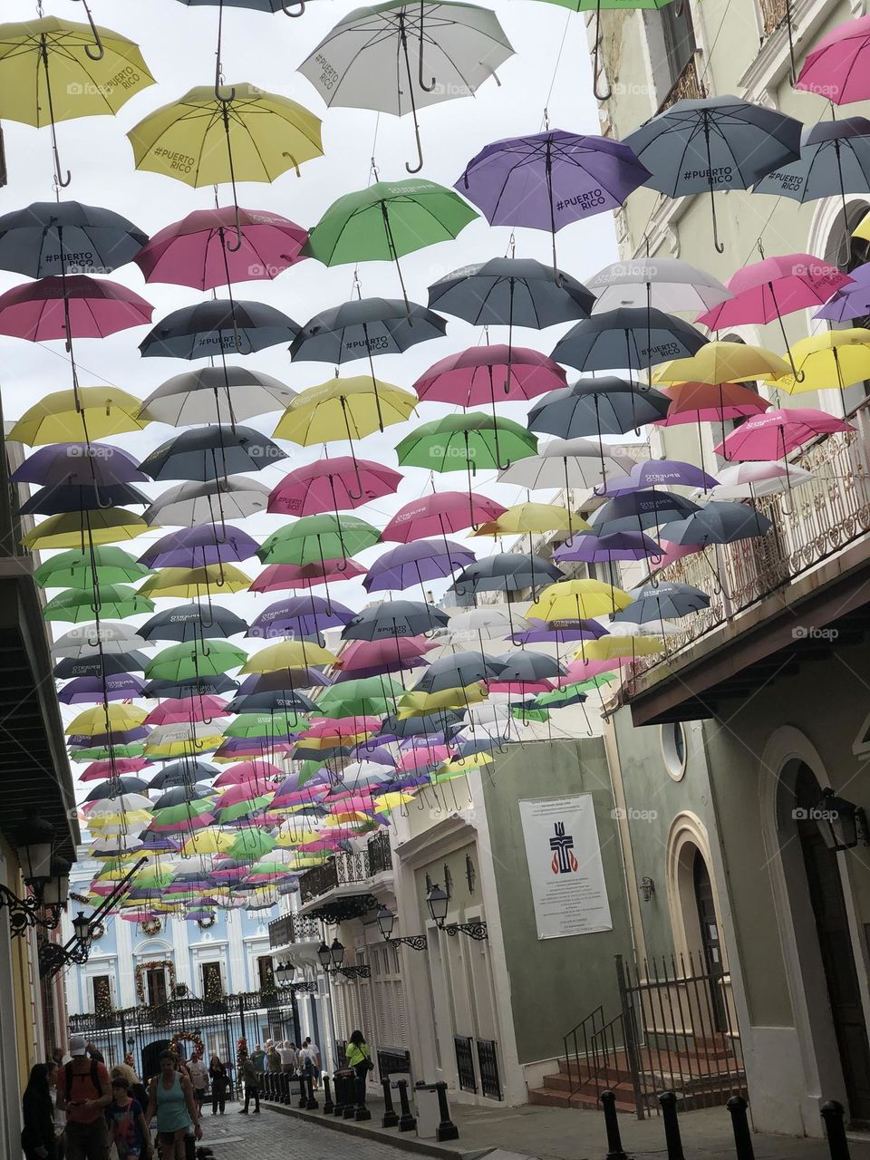 Multiple Color Umbrella’s Hanging Above Streets in Puerto Rico