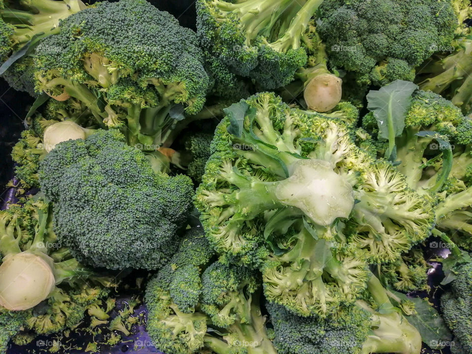 Bulk broccoli for sale in a grocery store