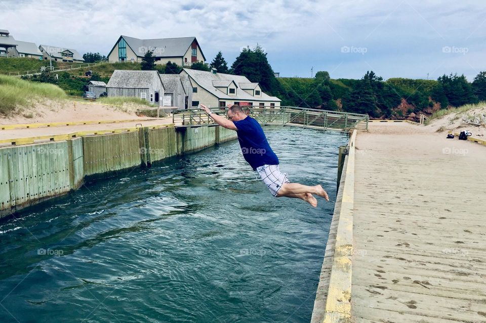 Some crazy person jumping into the Basin Head canal.