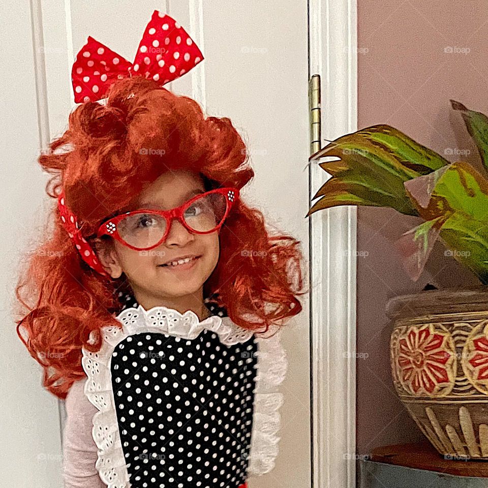 Toddler dressed up as Lucille Ball, toddler wears I Love Lucy costume, being funny with costumes on, iconic tv show costumes for toddlers 