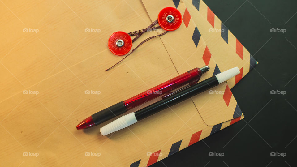 Job application envelope and red ballpoint pen